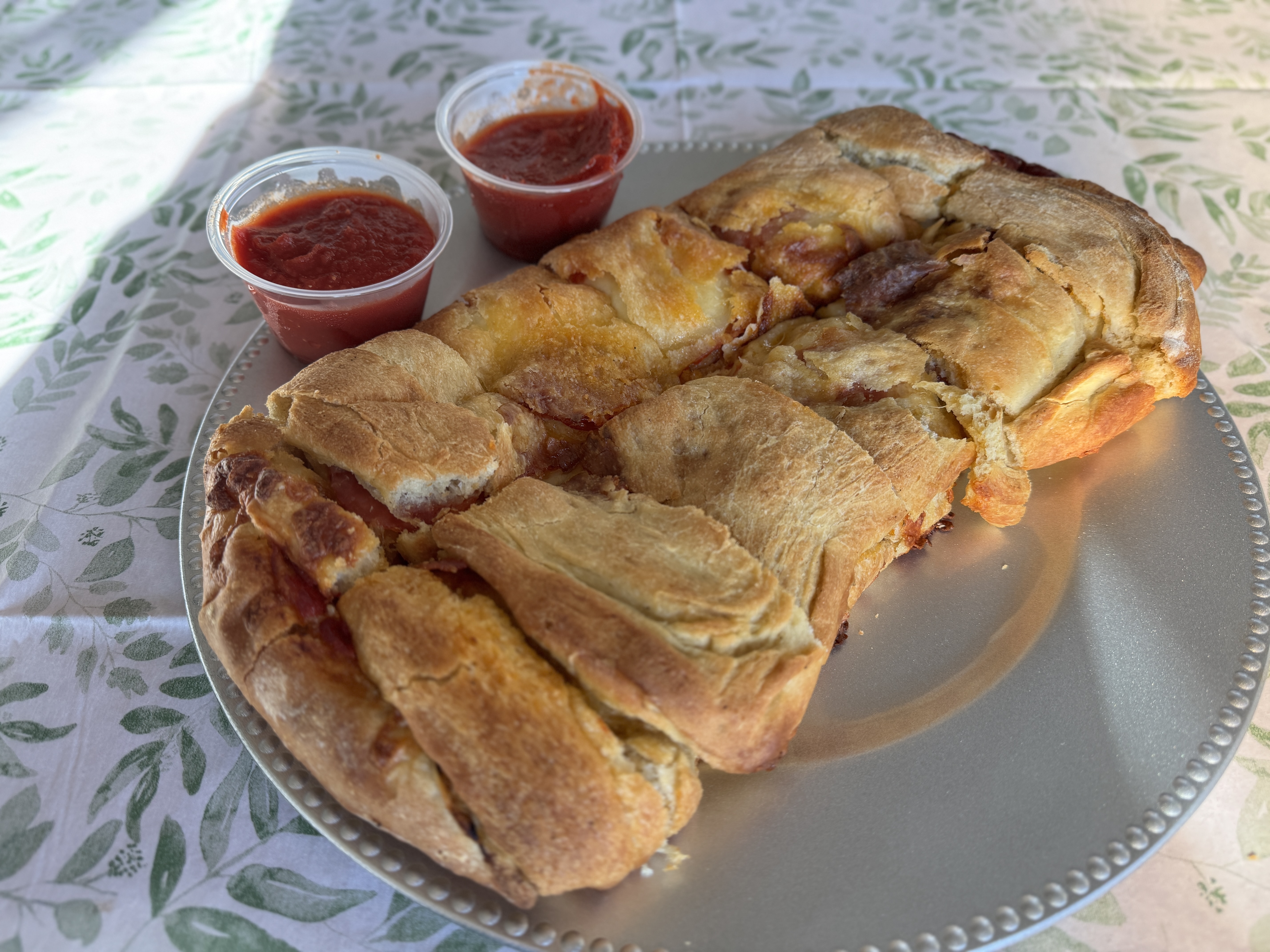 Garden salad topped with tomatoes, onion, peppers, and provolone